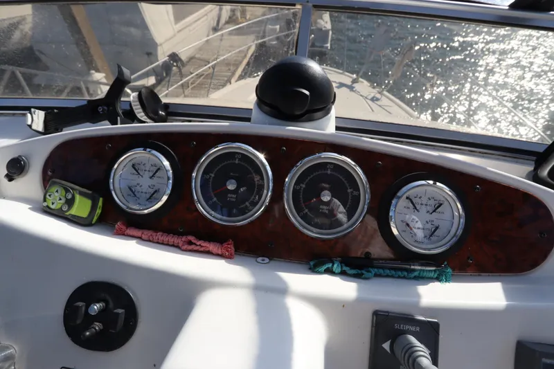 Slide: The Image of Dashboard of 2005 Meridian 459 Motoryacht with gauges and controls. - 26