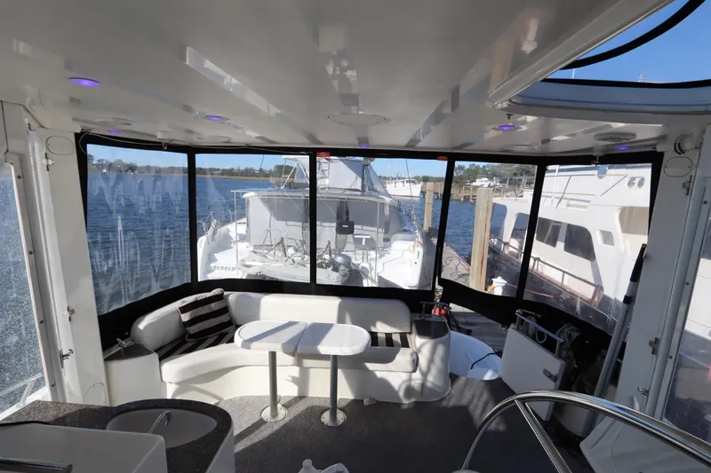Slide: The Image of Interior of 2005 Meridian 459 Motoryacht with seating and waterfront view. - 32