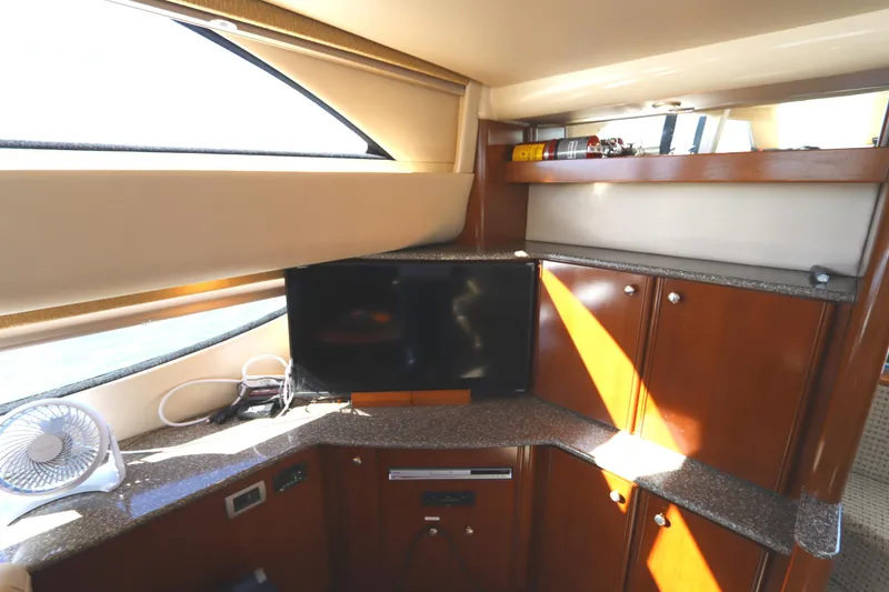 Slide: The Image of Interior of 2005 Meridian 459 Motoryacht with TV and wooden cabinetry. - 44