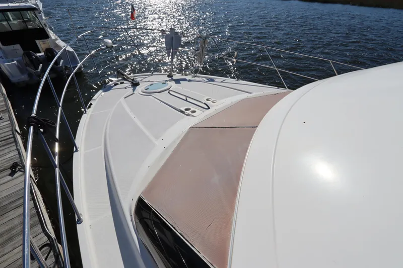 Slide: The Image of 2005 Meridian 459 Motoryacht docked, sunlit deck, calm waters. - 5