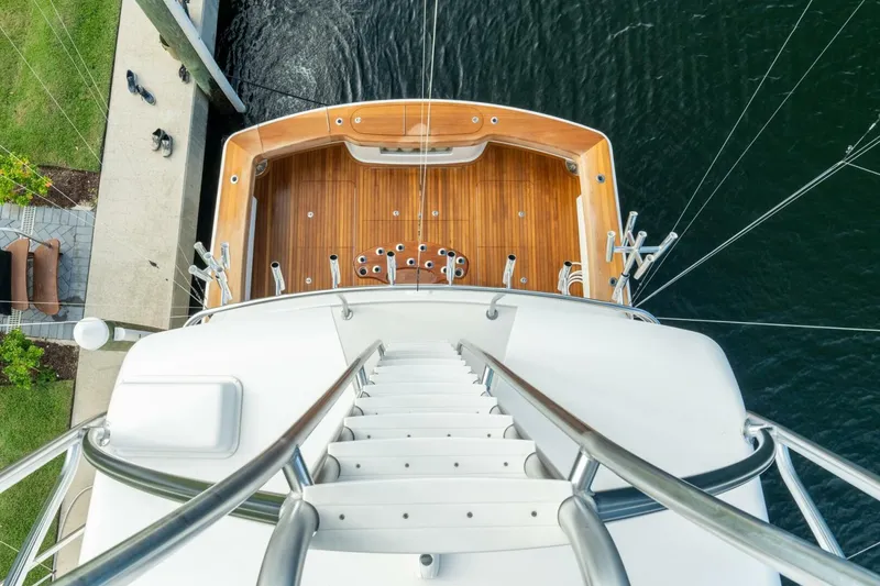 Slide: The Image of Aerial view of 2021 Viking 68 Enclosed Bridge Convertible yacht's deck and ladder. - 11