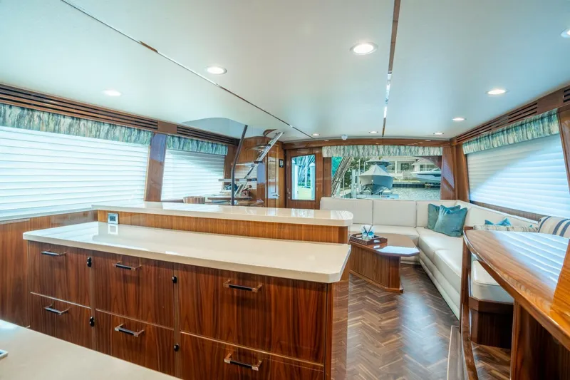 Slide: The Image of Luxurious interior of 2021 Viking 68 Enclosed Bridge Convertible yacht with modern furnishings. - 14
