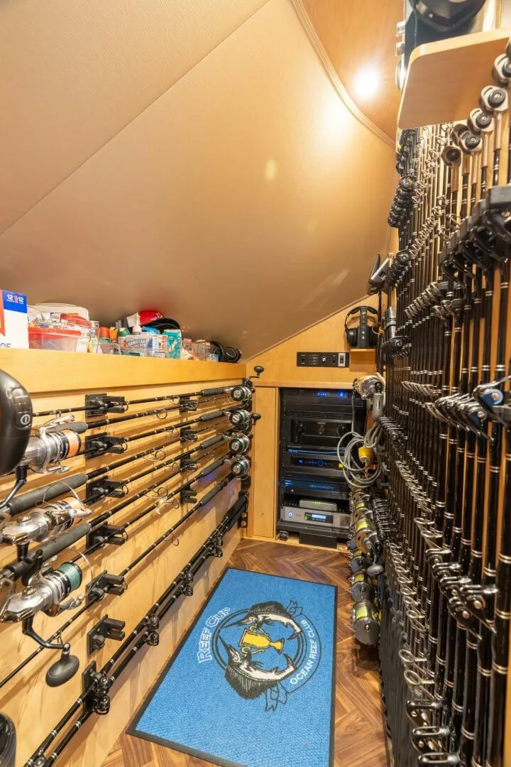 Slide: The Image of Fishing rod storage on 2021 Viking 68 Enclosed Bridge Convertible yacht, featuring organized racks and equipment. - 22