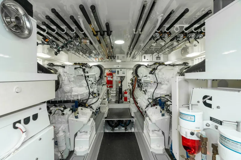 Slide: The Image of Engine room of 2021 Viking 68 Enclosed Bridge Convertible yacht, showcasing advanced machinery. - 34