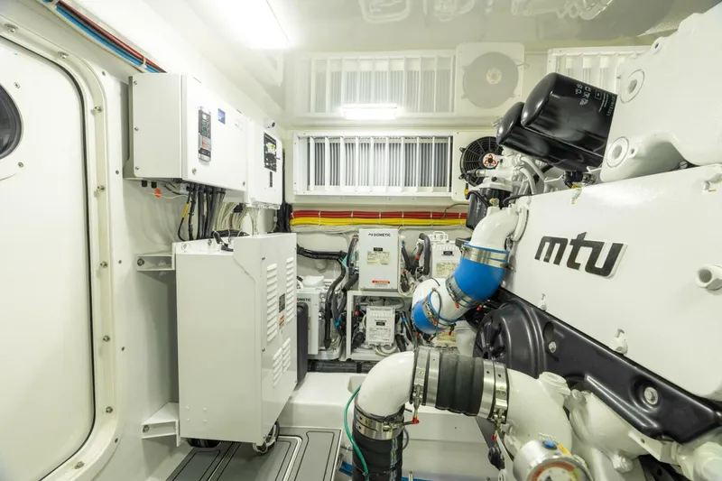 Slide: The Image of Engine room of 2021 Viking 68 Enclosed Bridge Convertible with MTU engine components. - 36