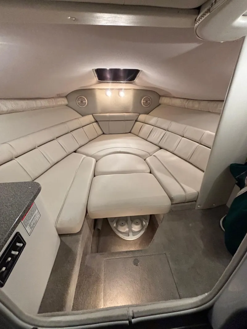 Slide: The Image of Interior of 2002 Crownline 215 CCR boat with plush seating and ambient lighting. - 3