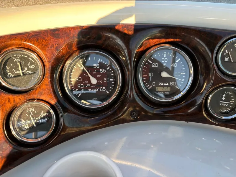 Slide: The Image of Dashboard gauges of a 2002 Crownline 215 CCR boat. - 6