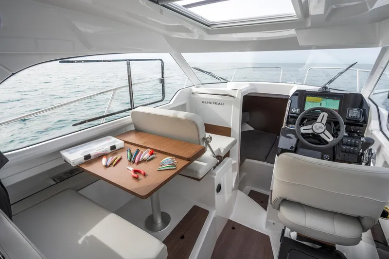 Slide: The Image of Interior of 2024 Beneteau Antares 8 Fishing boat with helm and seating area. - 12