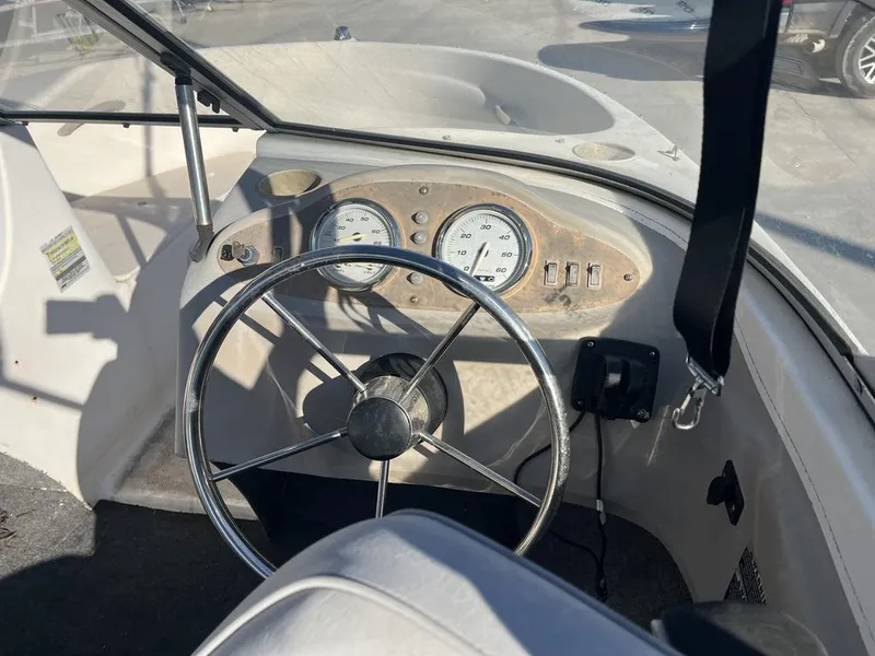 Slide: The Image of Interior view of a 2004 Bayliner 175 boat cockpit. - 8