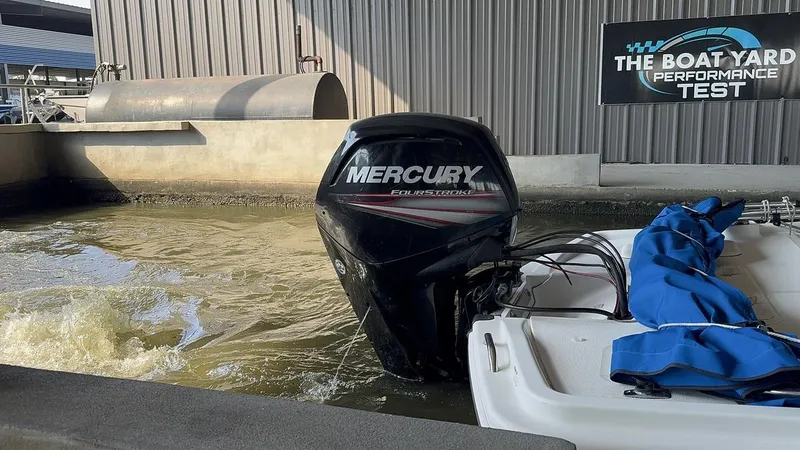 Slide: The Image of 2017 Mako Pro Skiff 19 CC with Mercury engine in performance test area. - 2
