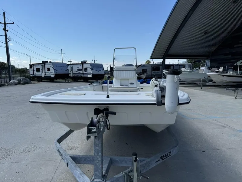 Slide: The Image of 2017 Mako Pro Skiff 19 CC boat on trailer in outdoor storage area. - 4