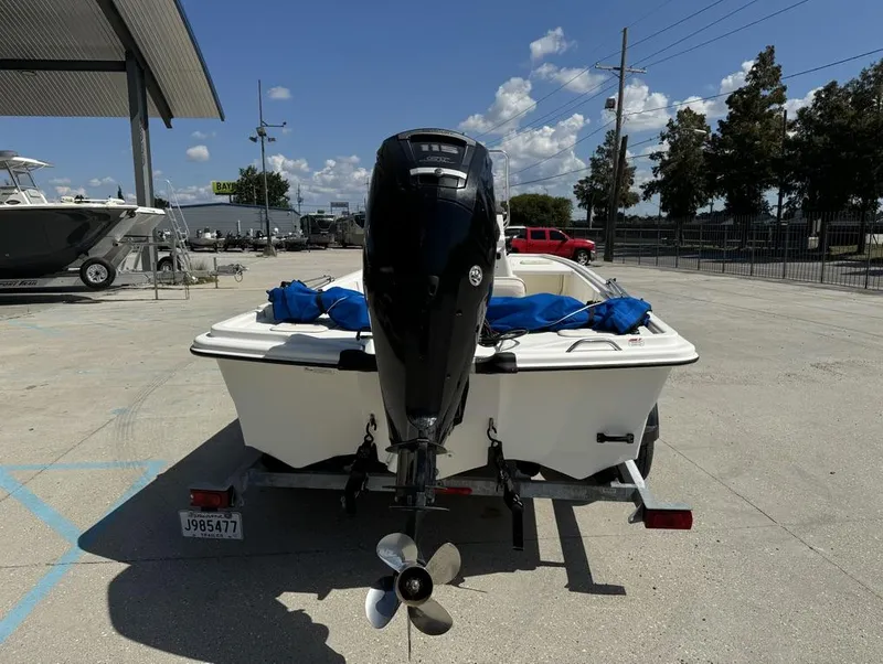 Slide: The Image of 2017 Mako Pro Skiff 19 CC boat on trailer, outdoor setting, clear sky. - 7