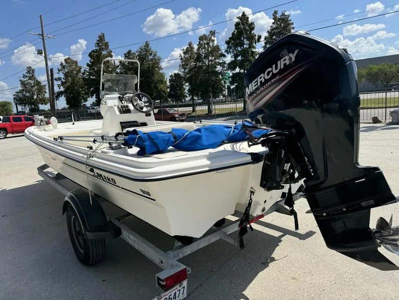 Slide: The Image of 2017 Mako Pro Skiff 19 CC boat with Mercury engine on trailer. - 8