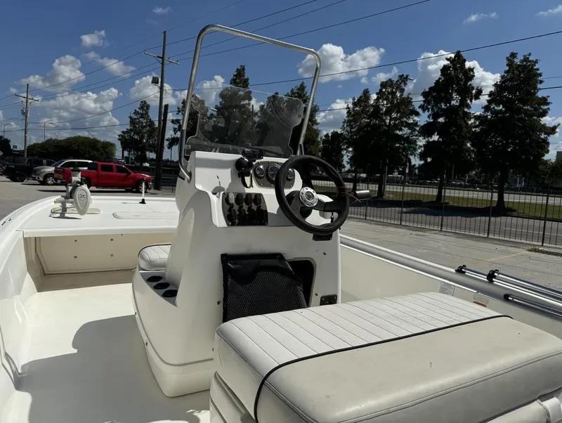 Slide: The Image of 2017 Mako Pro Skiff 19 CC boat interior with steering console and seating. - 9