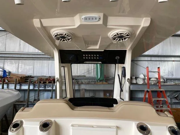 Slide: The Image of 2025 Scout 260 LXF boat interior with speakers and control panel. - 8