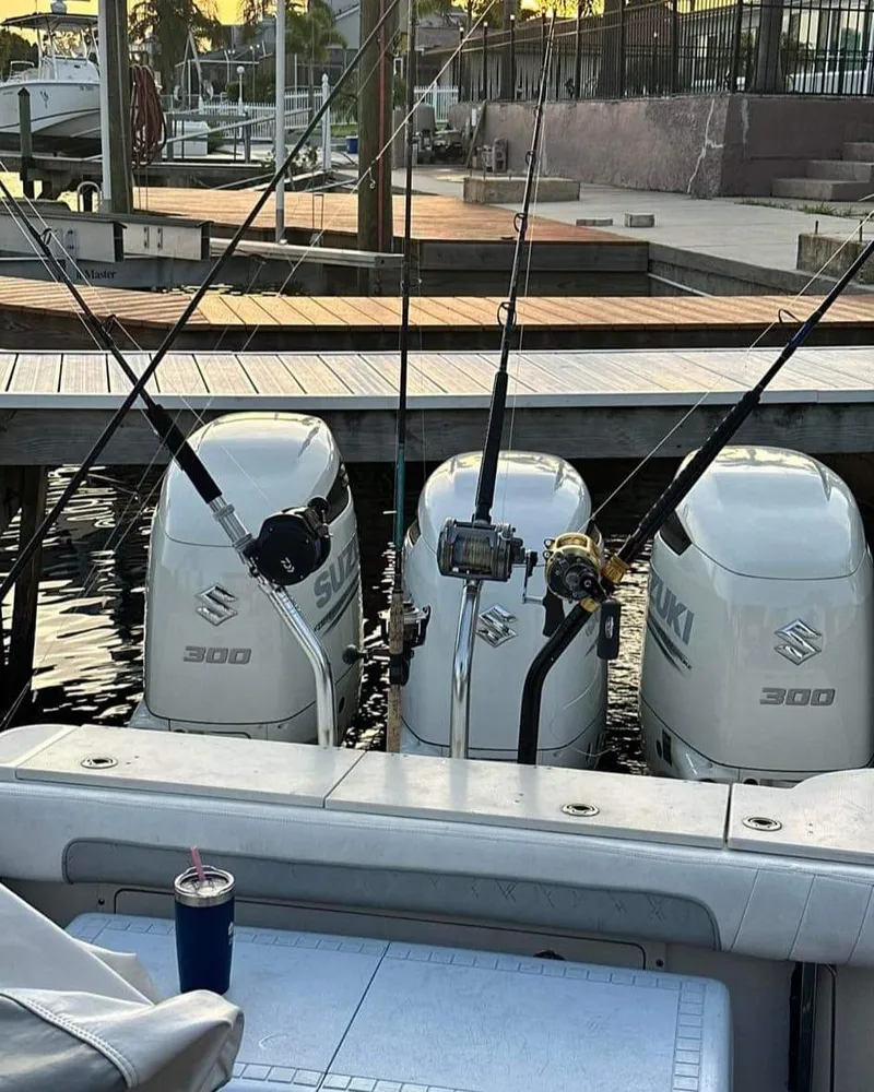 Slide: The Image of 2007 Scarab 35 Tournament boat with triple Suzuki 300 engines docked. - 10