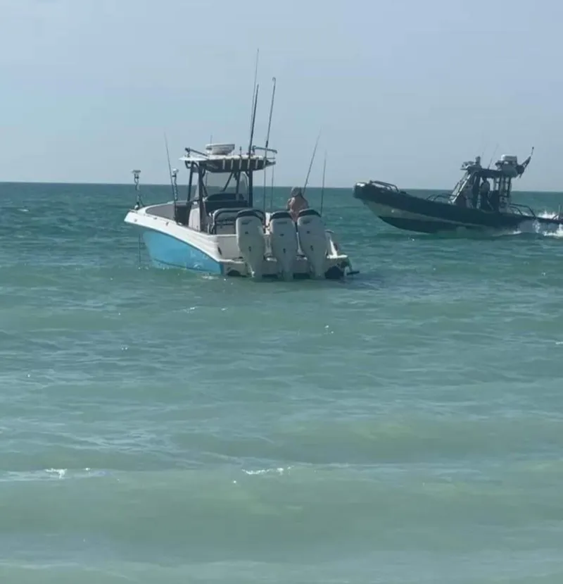 Slide: The Image of 2007 Scarab 35 Tournament boat on open water with another vessel nearby. - 11