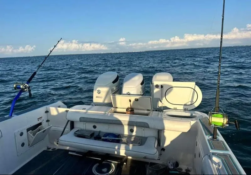 Slide: The Image of 2007 Scarab 35 Tournament boat on open sea, equipped for fishing. - 13