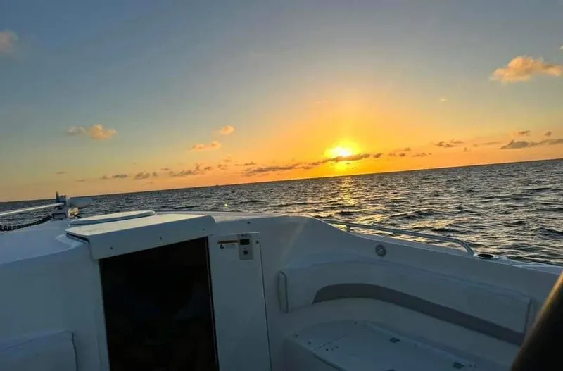 Slide: The Image of 2007 Scarab 35 Tournament boat at sunset on the ocean. - 3