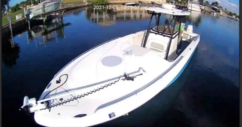 Slide: The Image of 2007 Scarab 35 Tournament boat on calm water, docked in a marina. - 4