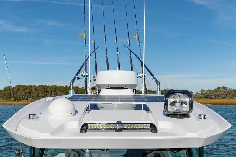 Slide: The Image of 2025 Axopar 29 CCX boat with fishing rods and radar equipment. - 20