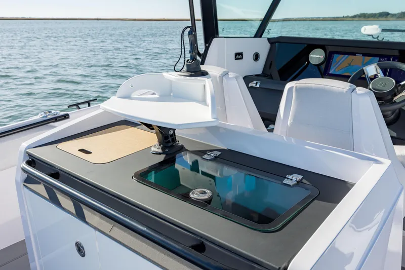 Slide: The Image of 2025 Axopar 29 CCX boat interior with modern dashboard and seating. - 22