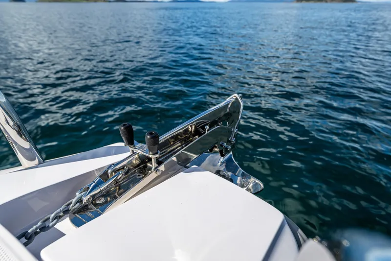 Slide: The Image of Axopar 28 boat anchor detail on calm water, 2022 model. - 29