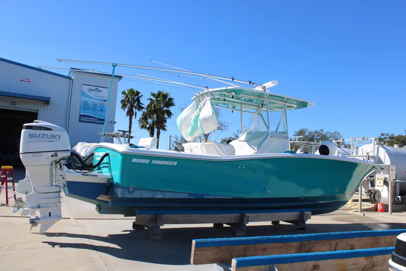 Slide: The Image of 2008 Jersey Cape 31 Little Devil boat with Suzuki engine on display. - 1