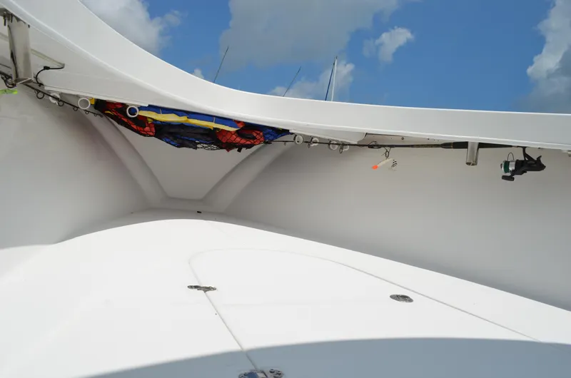 Slide: The Image of 2008 Jersey Cape 31 Little Devil boat interior with storage and fishing gear. - 12