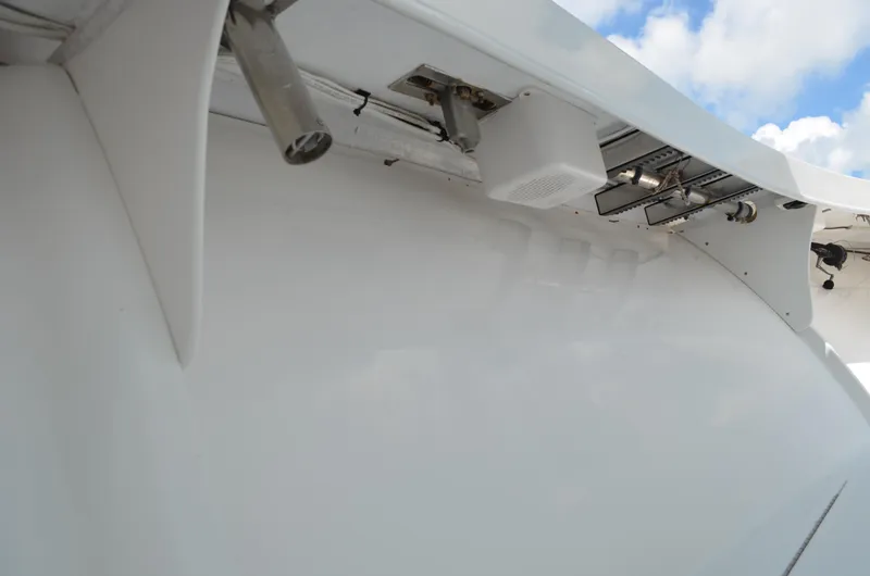 Slide: The Image of Close-up of 2008 Jersey Cape 31 Little Devil boat's sleek white exterior and fittings. - 13