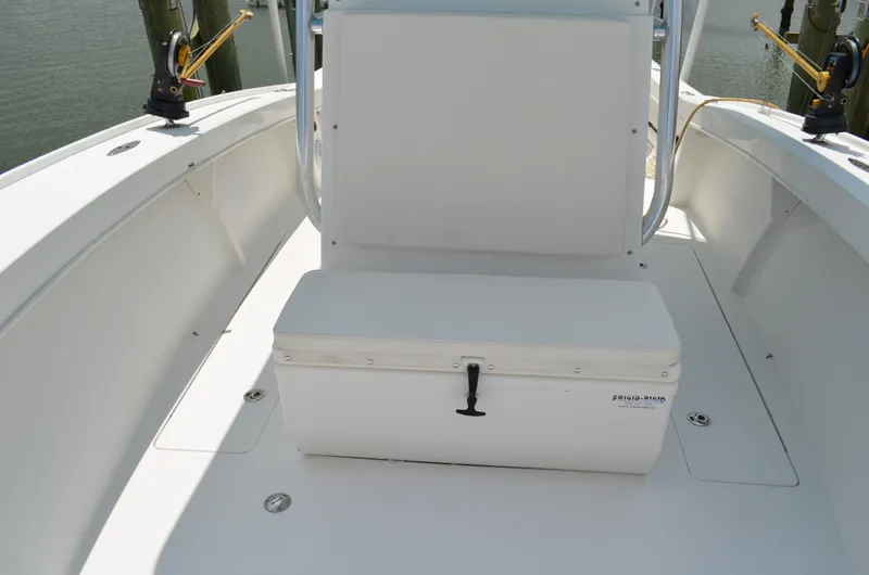 Slide: The Image of 2008 Jersey Cape 31 Little Devil boat interior with seating and storage. - 14