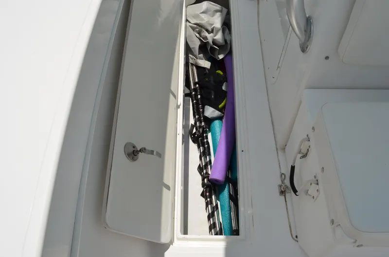Slide: The Image of Storage compartment on 2008 Jersey Cape 31 Little Devil boat with gear and accessories. - 15