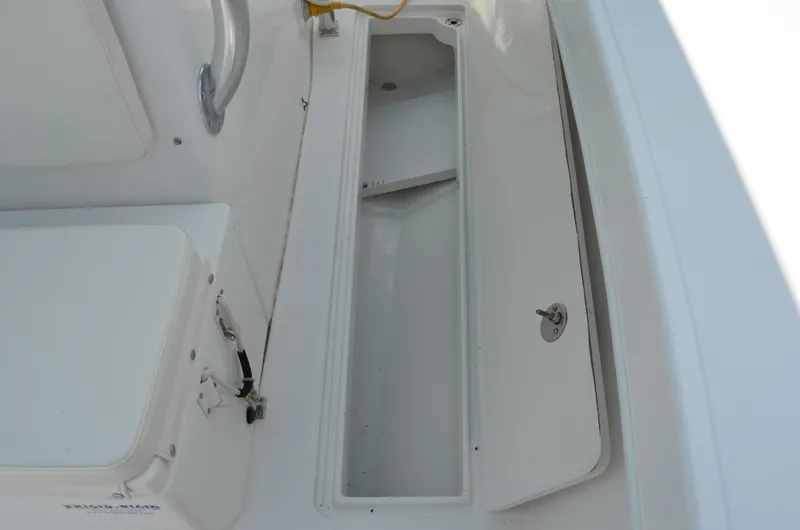 Slide: The Image of 2008 Jersey Cape 31 Little Devil boat storage compartment, open and empty. - 16