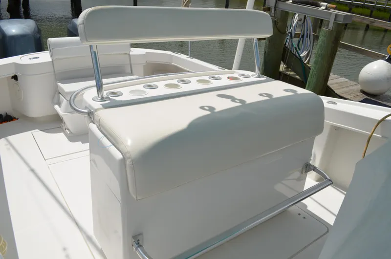 Slide: The Image of 2008 Jersey Cape 31 Little Devil boat interior with white seating and control panel. - 18