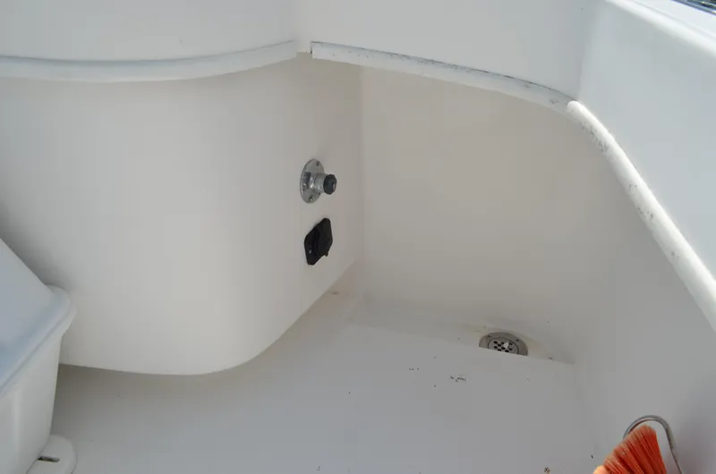 Slide: The Image of 2008 Jersey Cape 31 Little Devil boat interior detail with drain and fittings. - 23