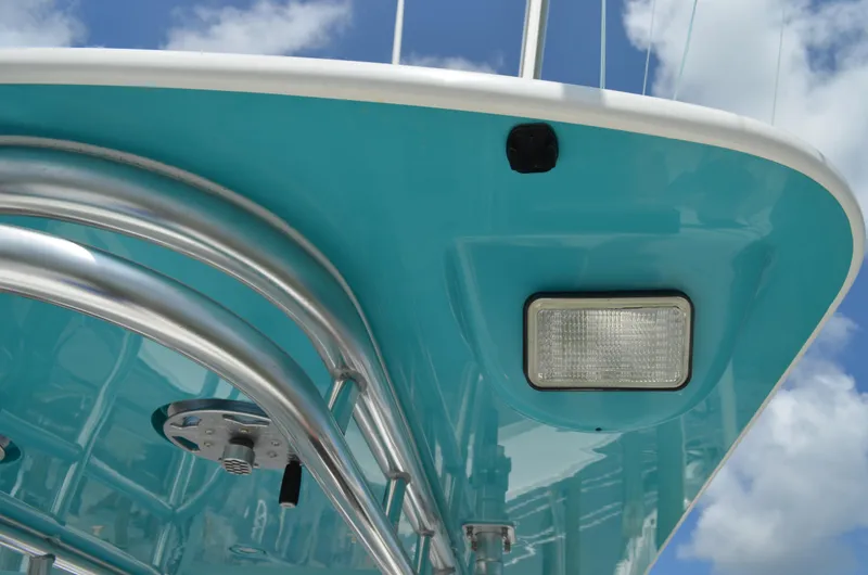 Slide: The Image of Close-up of 2008 Jersey Cape 31 Little Devil boat's turquoise hull and metal framework. - 25