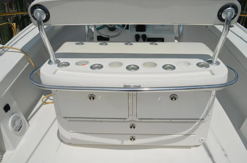 Slide: The Image of 2008 Jersey Cape 31 Little Devil boat interior with rod holders and storage compartments. - 27