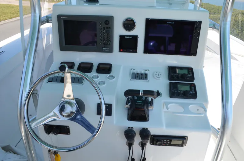 Slide: The Image of 2008 Jersey Cape 31 Little Devil boat dashboard with navigation and control systems. - 33