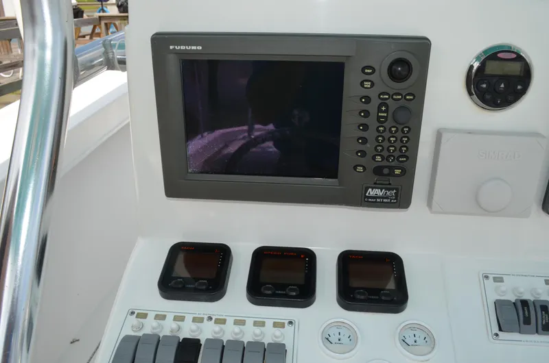 Slide: The Image of 2008 Jersey Cape 31 Little Devil boat dashboard with navigation and control instruments. - 36