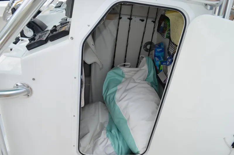Slide: The Image of Cabin interior of 2008 Jersey Cape 31 Little Devil boat with bedding and storage. - 37