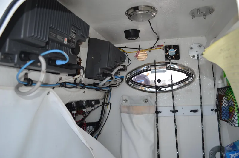 Slide: The Image of Interior of 2008 Jersey Cape 31 Little Devil boat with fishing rods and equipment. - 38