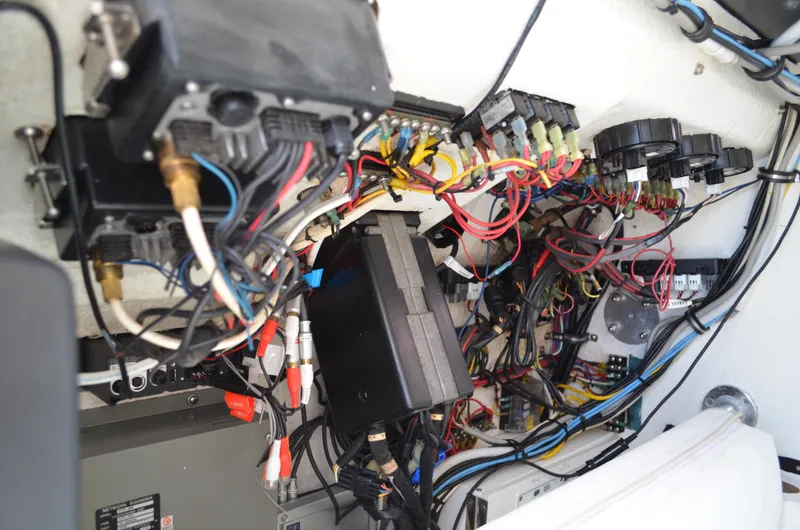 Slide: The Image of Electrical wiring and components inside a 2008 Jersey Cape 31 Little Devil boat. - 43