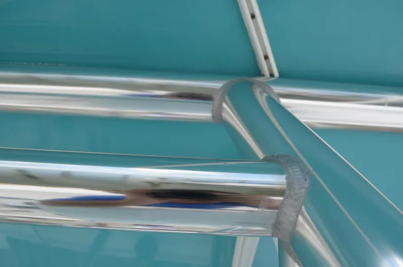 Slide: The Image of Close-up of 2008 Jersey Cape 31 Little Devil's polished metal framework against a teal background. - 45