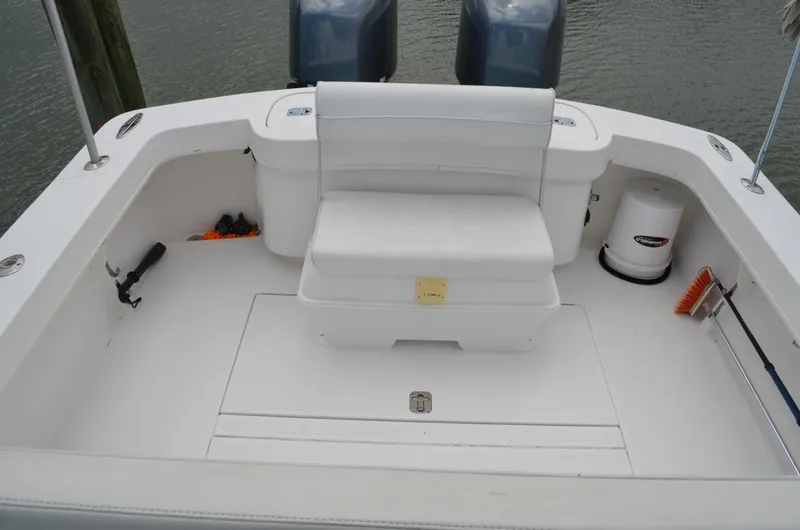 Slide: The Image of 2008 Jersey Cape 31 Little Devil boat deck with seating and twin engines. - 48