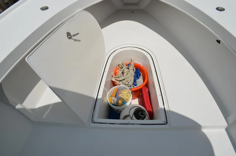 Slide: The Image of Storage compartment on 2008 Jersey Cape 31 Little Devil boat with ropes and buckets. - 9