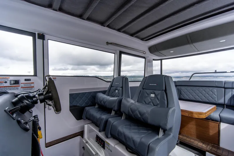 Slide: The Image of Interior of 2021 Axopar 37 XC boat with plush seating and modern design. - 15