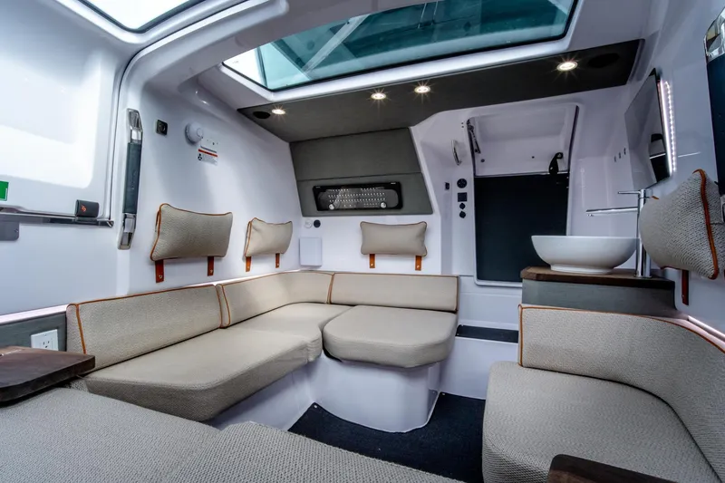 Slide: The Image of Luxurious interior of 2021 Axopar 37 XC boat with modern seating and skylight. - 19