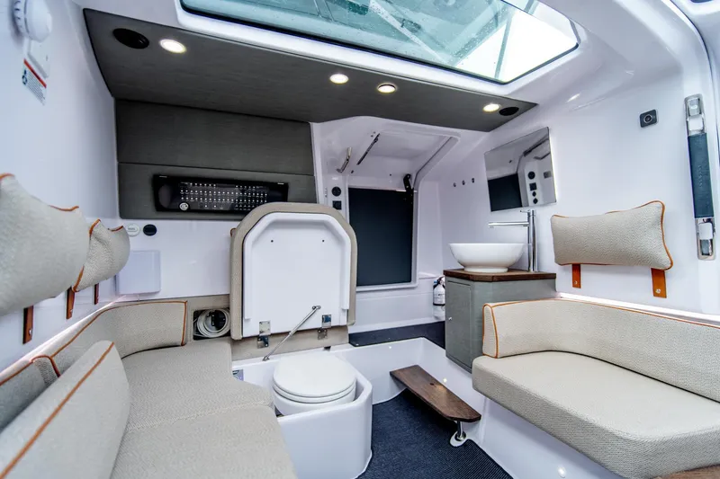 Slide: The Image of Luxurious interior of 2021 Axopar 37 XC boat with seating and modern amenities. - 21