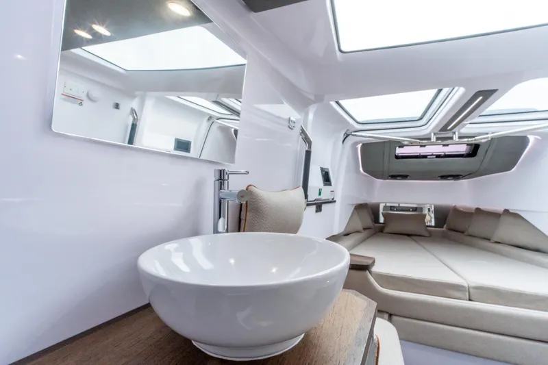 Slide: The Image of Luxurious interior of 2021 Axopar 37 XC boat with modern amenities and comfortable seating. - 24