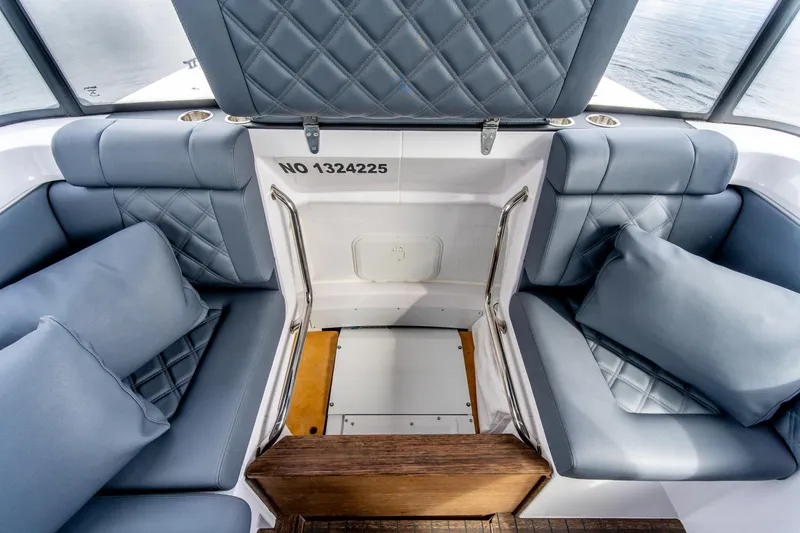 Slide: The Image of Luxurious seating area on 2021 Axopar 37 XC boat with quilted cushions. - 25